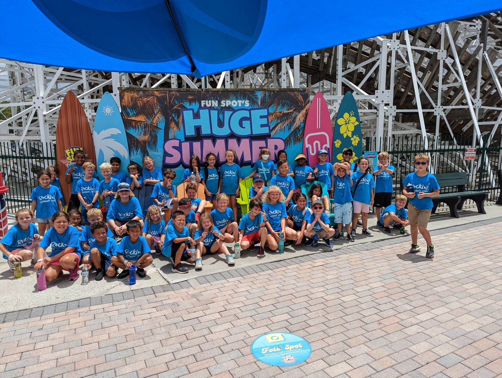 Summer campers in matching camp shirts on a field trip with Monarch Children's Academy